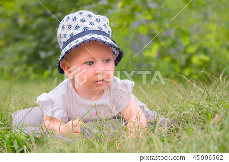 Happy childhood concept. Baby girl in hat, panama. 45906562
