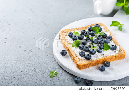 Sandwich with goat cheese and blueberries Sandwich with goat cheese and blueberries 45908291