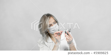 The girl laboratory technician examines samples The girl laboratory technician examines samples 45909825