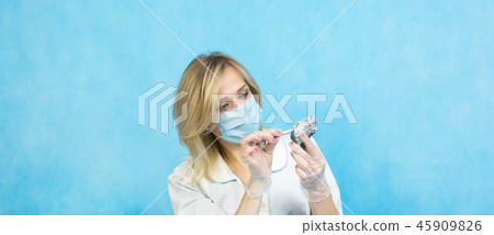The girl laboratory technician examines samples The girl laboratory technician examines samples 45909826
