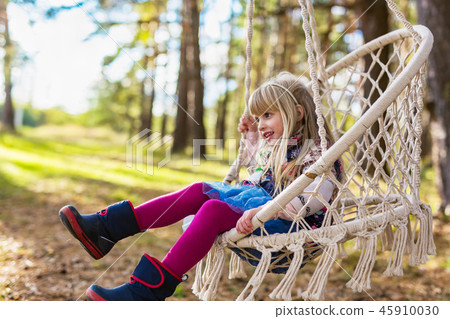 Cute girl in colorful hammock 45910030