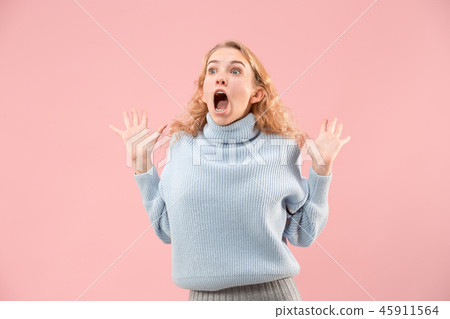 Beautiful woman looking suprised isolated on pink 45911564