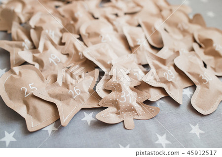 Crafted christmas presents wrapped in paper bags. December 31. Crafted christmas presents wrapped in paper bags. December 31. 45912517