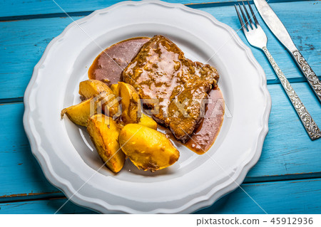 Grilled pork steak and fried potatoes Grilled pork steak and fried potatoes 45912936