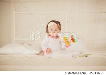 Little girl in pajamas 45913636