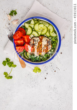 Vegan bean cutlet with vegetable salad and tahini Vegan bean cutlet with vegetable salad and tahini 45913811