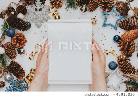 Woman hands with notepad on Christmas background 45913836