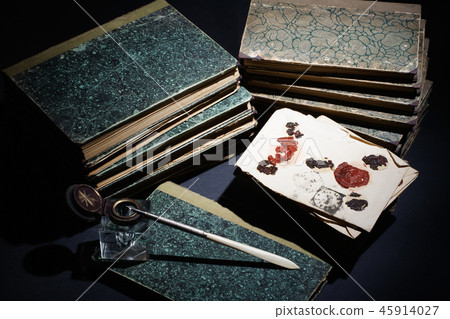 old books, papers, ink pen and inkpot on black old books, papers, ink pen and inkpot on black 45914027