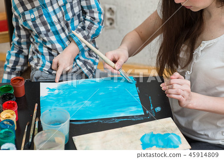 mother with boys son paint colors at home 45914809