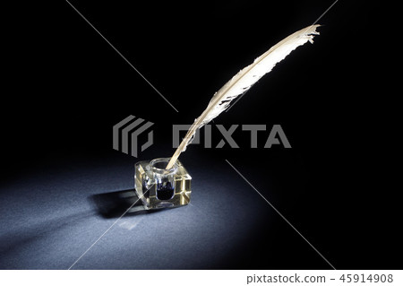 background with old ink bottle, books, and quill 45914908