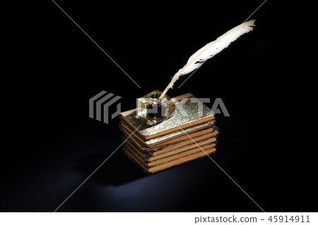 background with old ink bottle, books, and quill 45914911