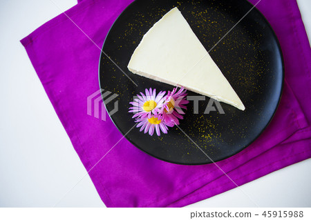 very tasty and beautiful creamy cheesecake decorated with flowers 45915988
