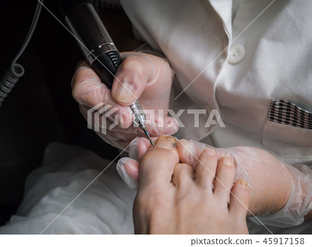 Hardware pedicure in the beauty salon. Hardware pedicure in the beauty salon. 45917158