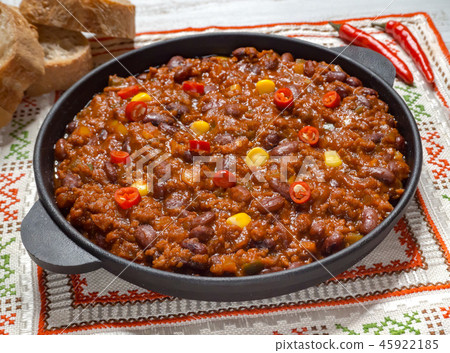 Texas chili. Chili con carne in frying pan. Texas chili. Chili con carne in frying pan. 45922185