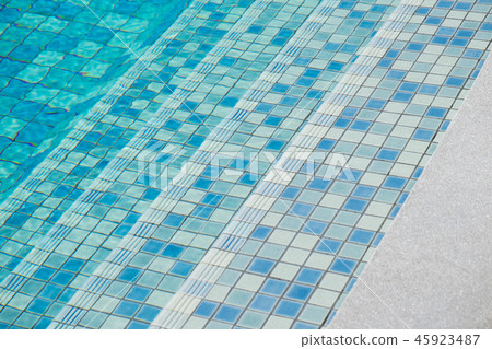 Stairs in swimming pool, Blue background. 45923487