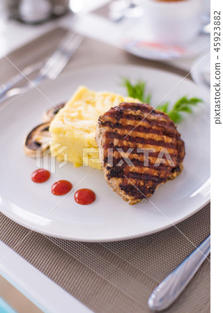 Grilled pork loin meat with mashed potatoes Grilled pork loin meat with mashed potatoes 45923882