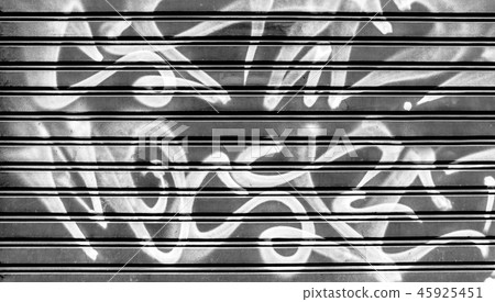 Black garage gate with graffiti Black garage gate with graffiti 45925451