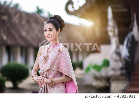 Beautiful Thai girl in Thai traditional costume. Beautiful Thai girl in Thai traditional costume. 45925981
