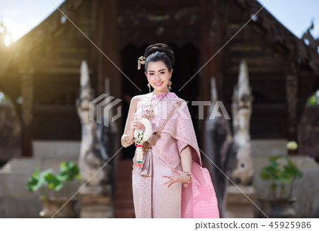 Beautiful Thai girl in Thai traditional costume. Beautiful Thai girl in Thai traditional costume. 45925986