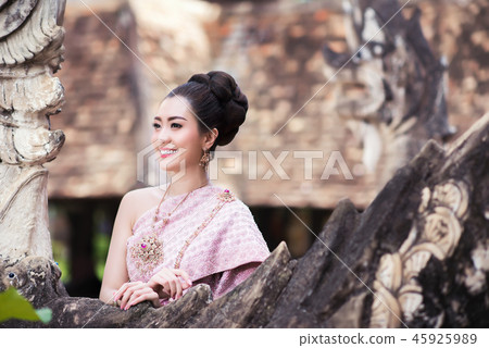 Beautiful Thai girl in Thai traditional costume. Beautiful Thai girl in Thai traditional costume. 45925989
