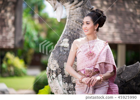 Beautiful Thai girl in Thai traditional costume. Beautiful Thai girl in Thai traditional costume. 45925990