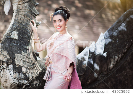 Beautiful Thai girl in Thai traditional costume. Beautiful Thai girl in Thai traditional costume. 45925992