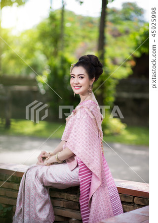 Beautiful Thai girl in Thai traditional costume. Beautiful Thai girl in Thai traditional costume. 45925998