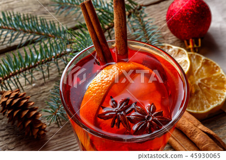 Mulled wine in a glass on a wooden background 45930065