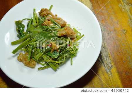 fried Chayote sprout with crispy chicken on plate fried Chayote sprout with crispy chicken on plate 45930742