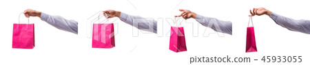 Hand holding shopping bags with christmas shopping on white back Hand holding shopping bags with christmas shopping on white back 45933055