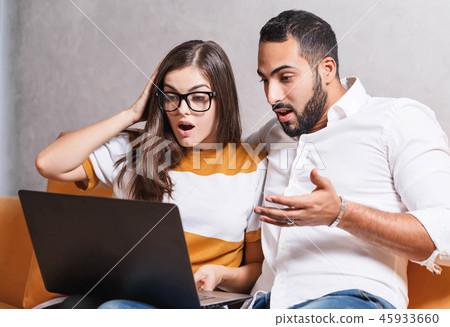 Young Couple Using Laptop 45933660