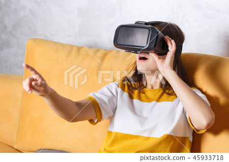 Brunette Girl Testing VR Device 45933718