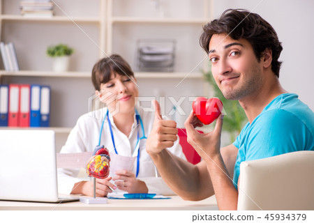 Young patient visiting doctor cardiologist Young patient visiting doctor cardiologist 45934379