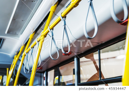 handrails in the cabin of a modern and comfortable city bus handrails in the cabin of a modern and comfortable city bus 45934447