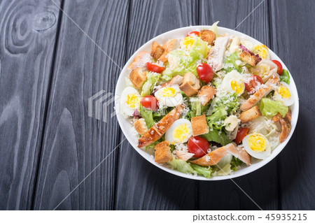Salad ceasar with chicken , eggs and tomatoes 45935215