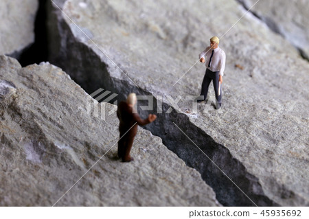 Rock cleft and two businessmen 45935692