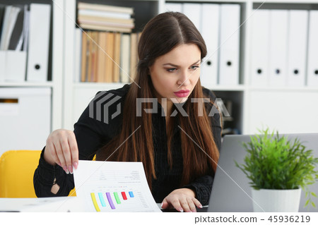 Beautiful brunette smiling businesswoman work with laptop 45936219