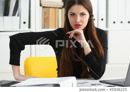 Beautiful smiling clerk girl at workplace talk to visitor Beautiful smiling clerk girl at workplace talk to visitor 45936225