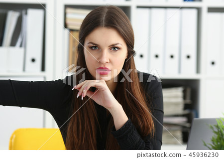 Beautiful smiling clerk girl at workplace talk to visitor Beautiful smiling clerk girl at workplace talk to visitor 45936230