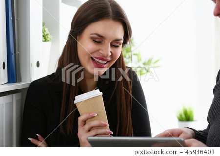 Group of people in office look at mobile tablet pc Group of people in office look at mobile tablet pc 45936401