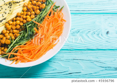 Buddha bowl with avocado cucumber carrot chickpea Buddha bowl with avocado cucumber carrot chickpea 45936796