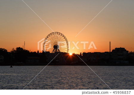 Ferris wheel on the background of sunrise Ferris wheel on the background of sunrise 45936837