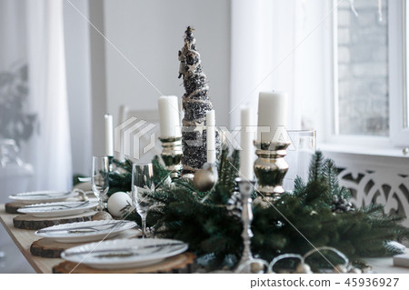 Table served for Christmas dinner in living room 45936927