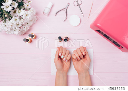 Flatlay of female hands with shellac covering Flatlay of female hands with shellac covering 45937253