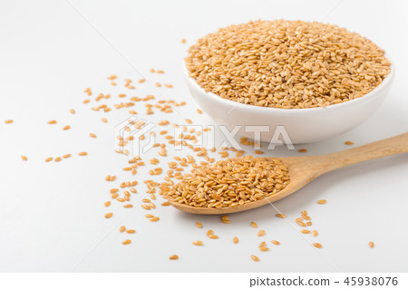 Golden flaxseed background with space 45938076