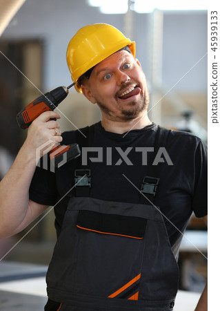 Idiot worker using electric drill portrait 45939133