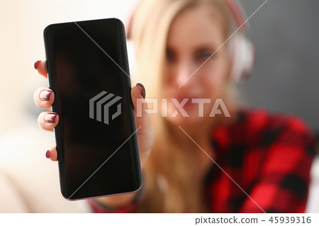 Portrait of a woman at home in headphones Portrait of a woman at home in headphones 45939316