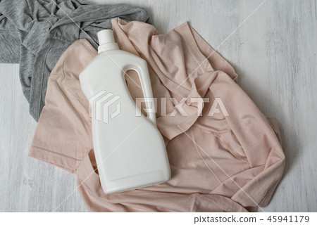 Clothes and bottle with detergent. Top view 45941179