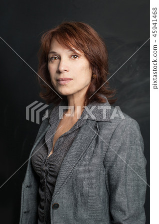 Confident business woman in gray suit Confident business woman in gray suit 45941468