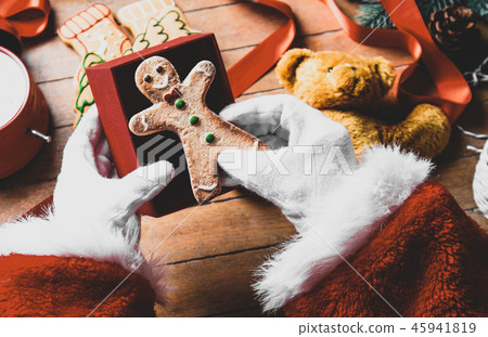 Santa Claus have wrapping a Christmas cookie Santa Claus have wrapping a Christmas cookie 45941819